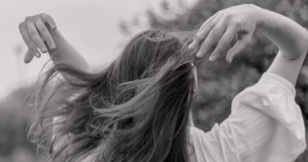 Woman waving her hair back